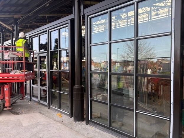 Commercial building with modern cladding systems being installed to meet safety, compliance, and performance requirements. 