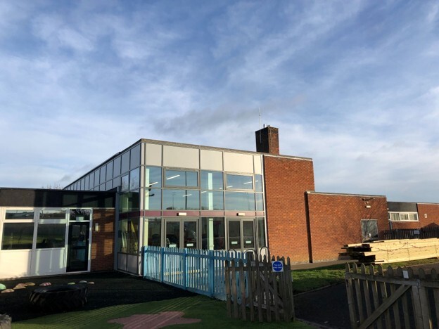 Modern commercial building highlighting the impact of the Building Safety Levy on residential construction and building compliance. 