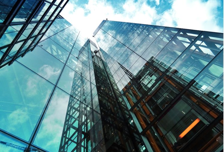 Facade high rise buildings with glass curtain walling designed for building weatherisation and protective measures for UK high rise buildings against storm damage. 