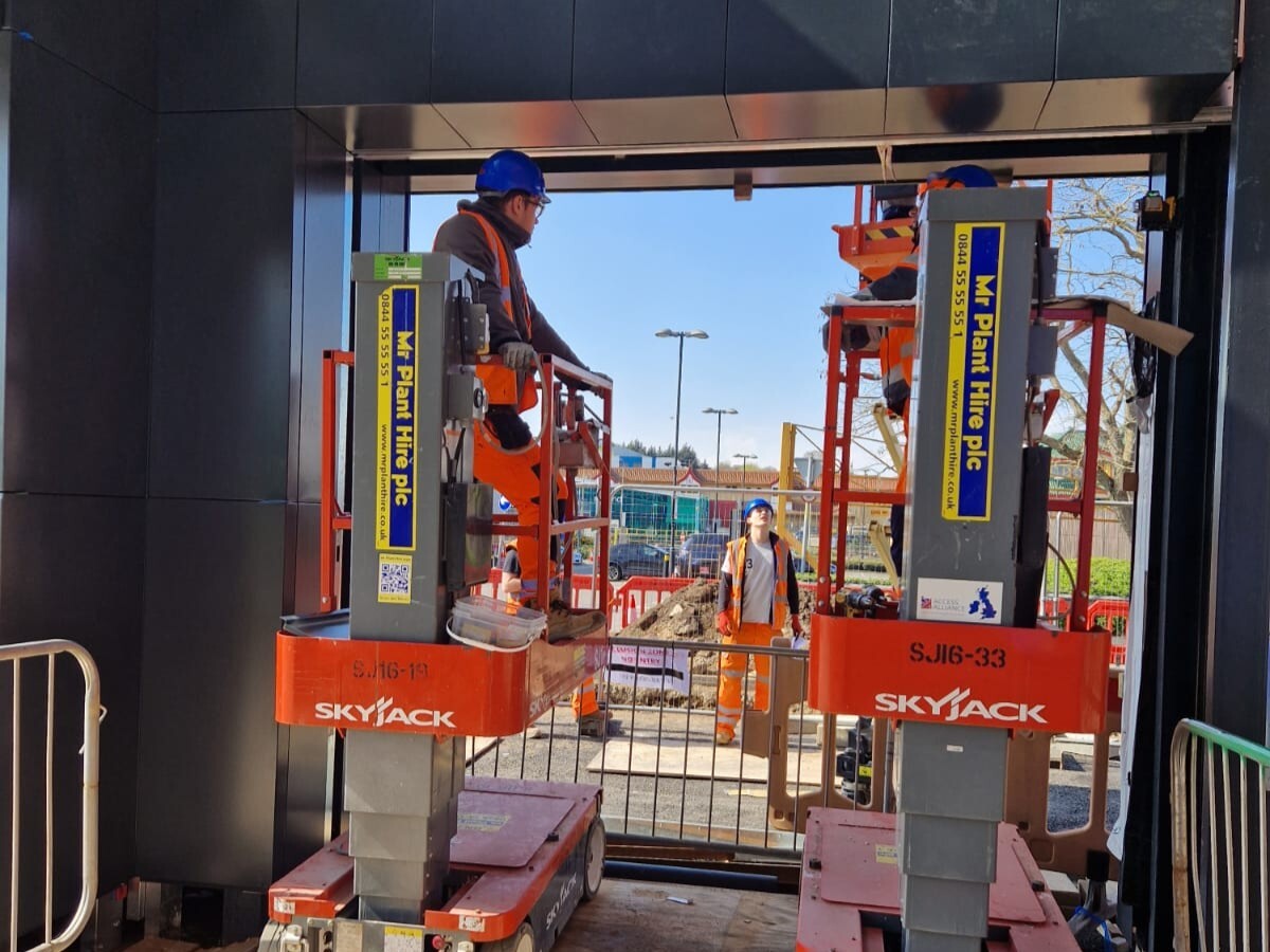 Glazing contractors work on the structure of a building to ensure the glazing is secure once installed.